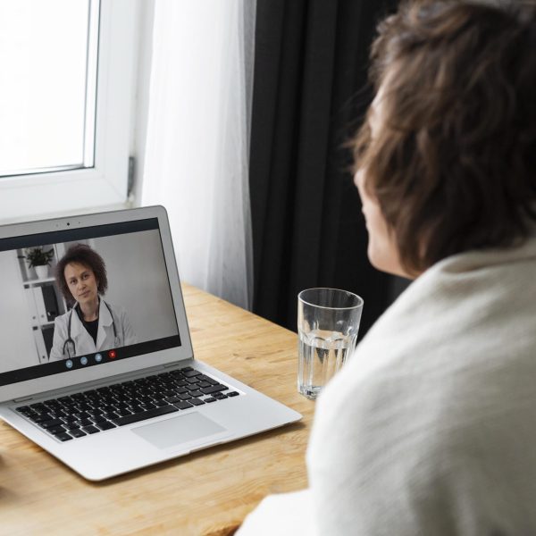 sick-young-man-talking-his-doctor-online remote-patients-monitoring